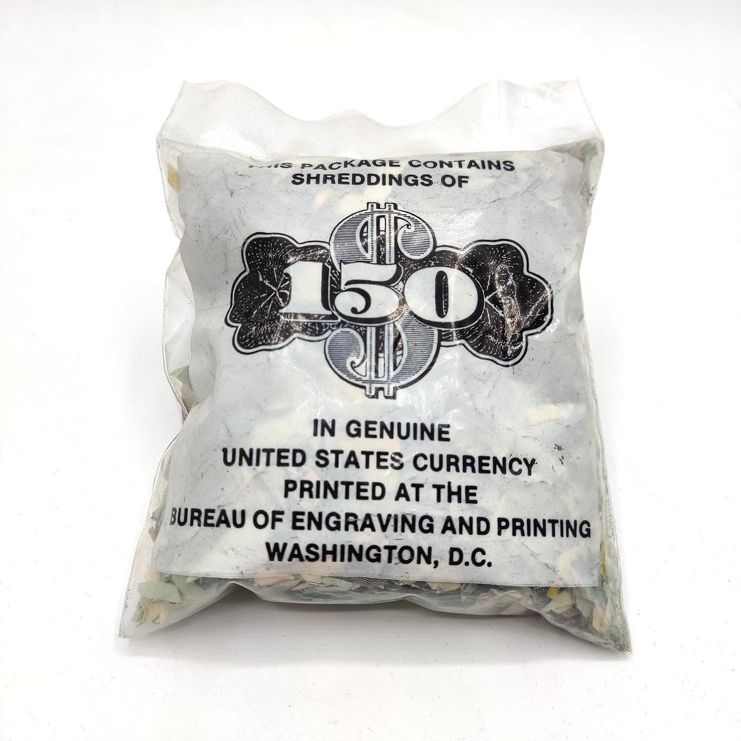 Discover the treasure in this bag! 150 authentic dollars cut into pieces.